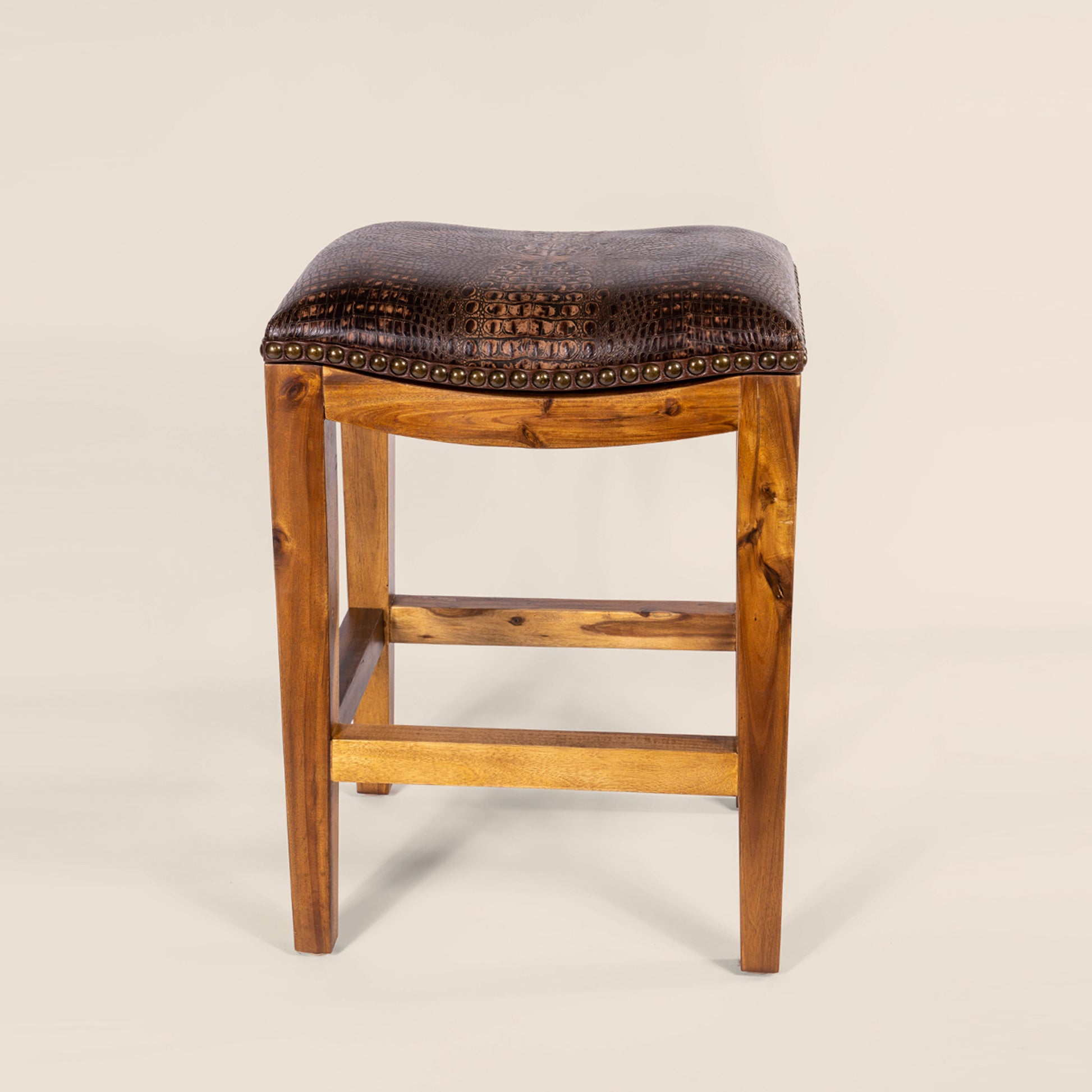 Platzer Saddle Stool in dark brown crocodile leather – front view