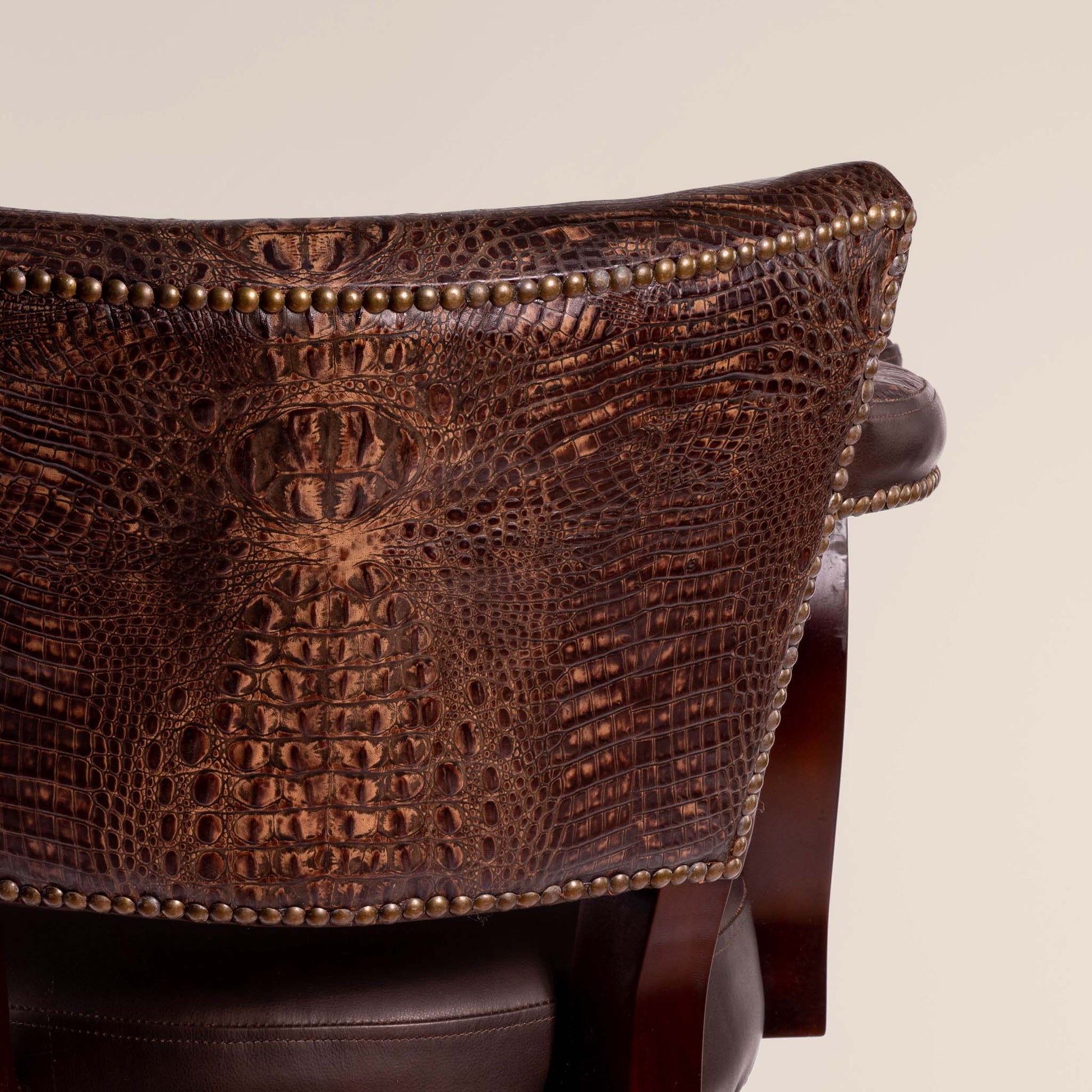 Trophy Swivel Stool in dark brown crocodile leather – detail view