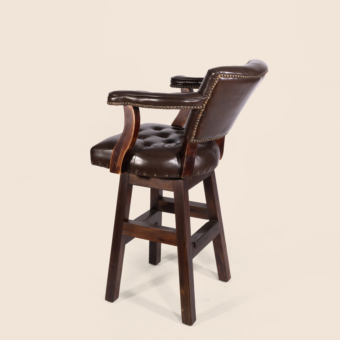 Trophy Swivel Stool in tufted leather – side view