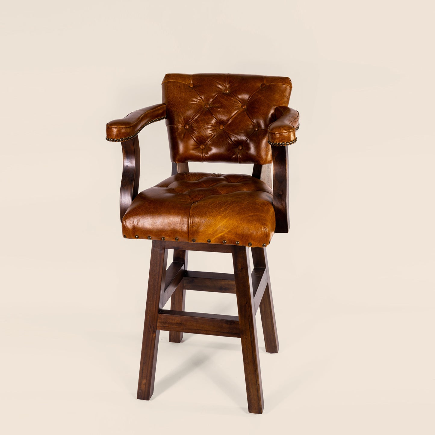 Trophy Swivel Stool in tufted leather – front view