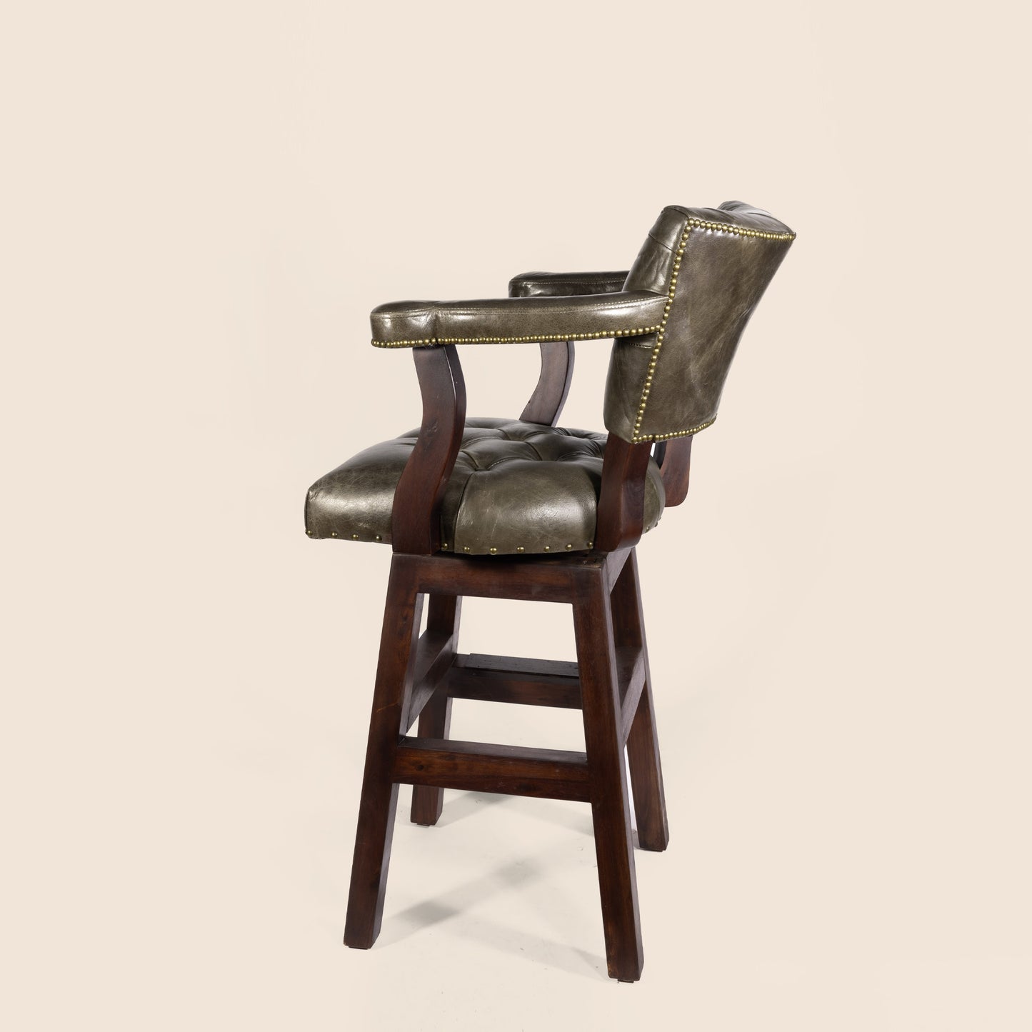 Trophy Swivel Stool in tufted leather – side view